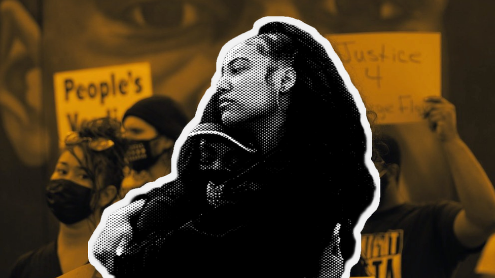 Two black women hugging in the street after the Derek Chauvin verdict was announced