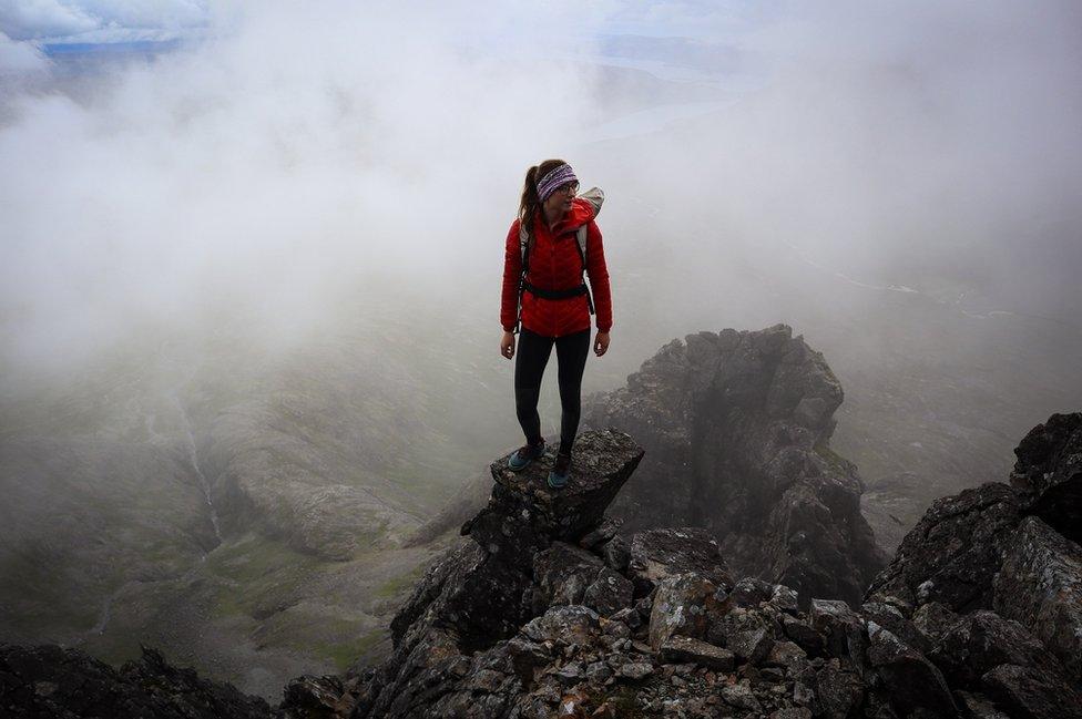 Anna Taylor standing on the top of a rock