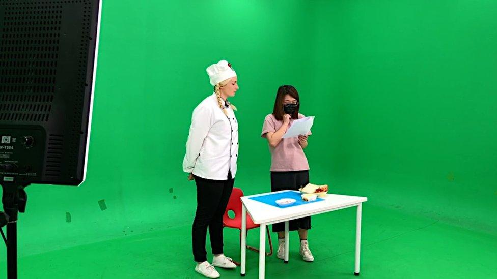 Jen Smith filming a TV show in front of a green screen