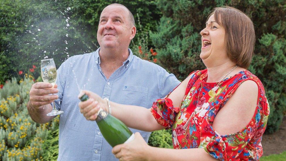 Alan and Claire Gray with champagne