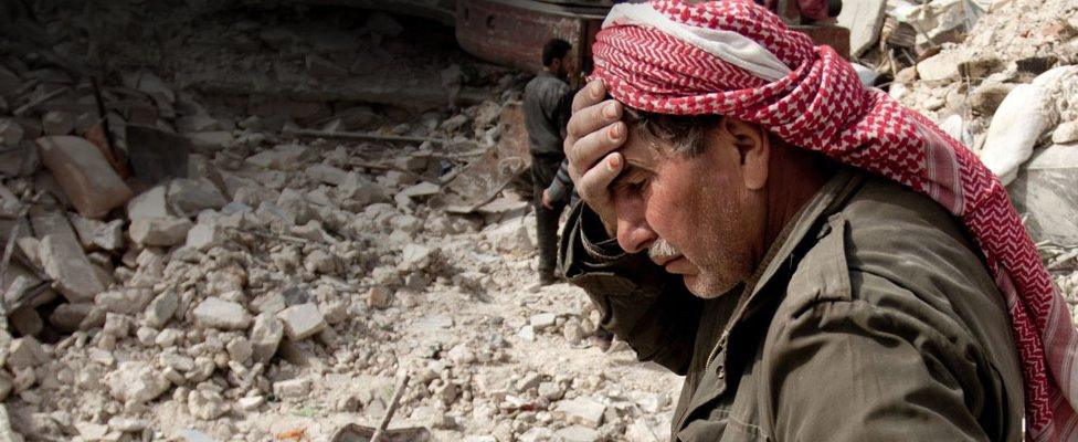 Grieving Syrian man