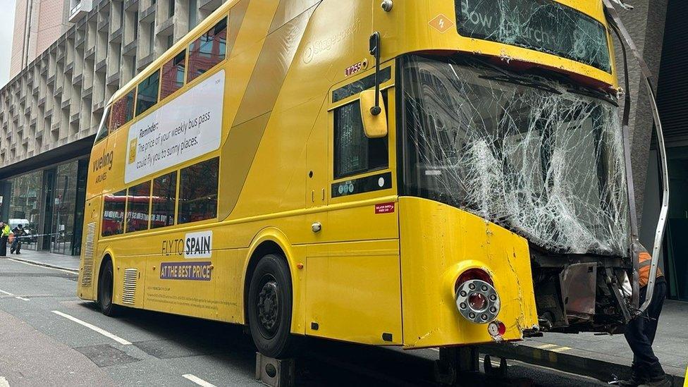 Image showing the badly damaged windscreen, front bumper and headlights of the bus after the crash