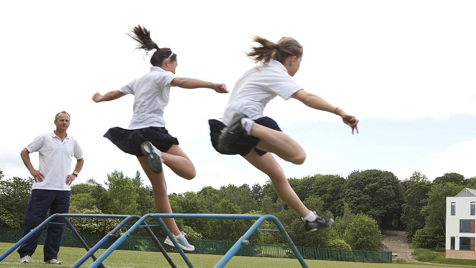 Pupils doing outdoor PE