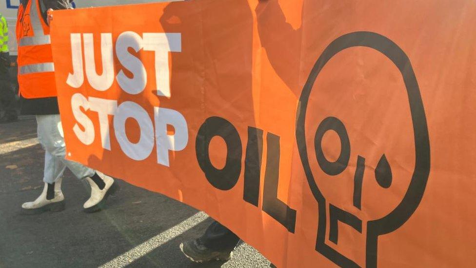 A banner for environmentalist group Just Stop Oil