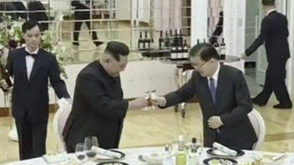 Kim Jong-un and a South Korean official raise a toast over dinner