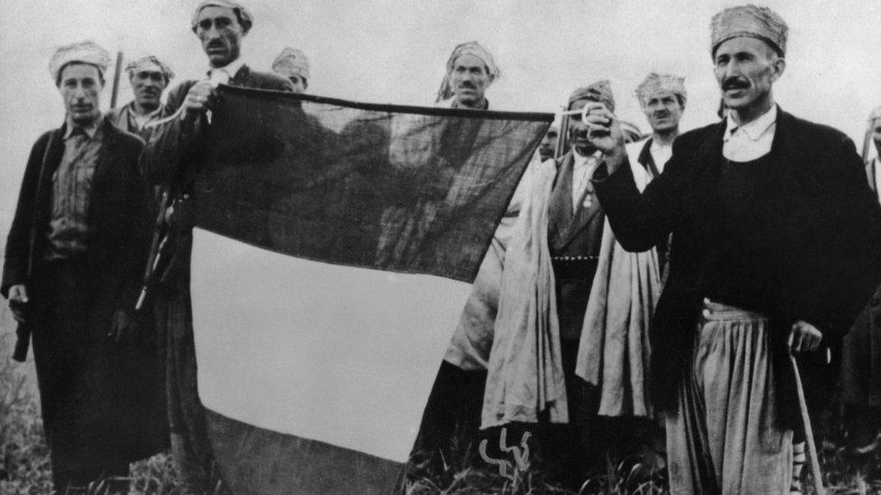 French troops with a recaptured tricolour during the Algerian War of Independence, 1956.