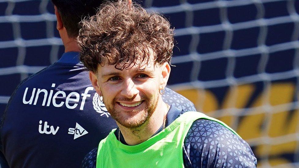 Tom Grennan smiling at training.