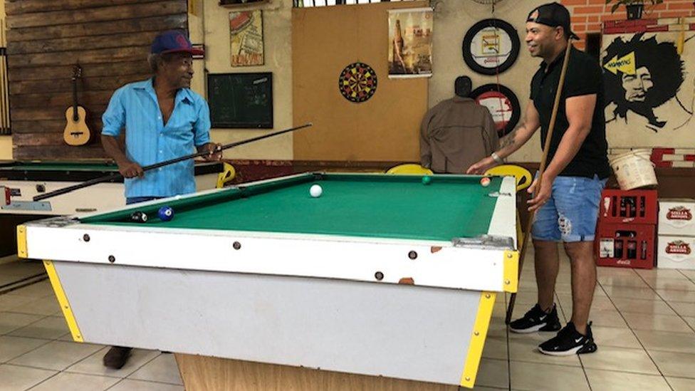 Ed and his dad play pool together