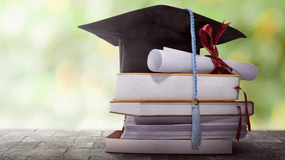 File photo of books and mortarboard