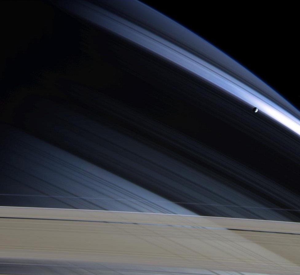 Mimas against Saturn's northern hemisphere