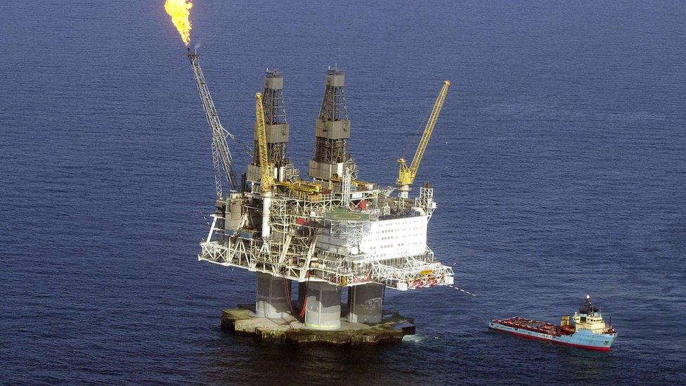 A flame burns off excess gas fumes on the top of the five-billion dollar drilling platform Hybernia off the coast of Newfoundland April 21, 2003 in the north Atlantic Ocean