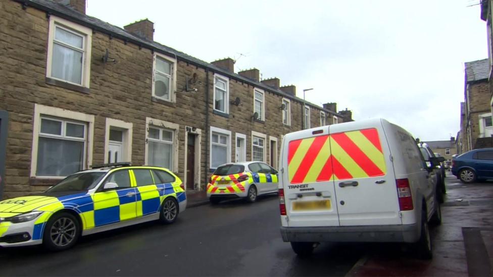 Crime scene with police vehicles