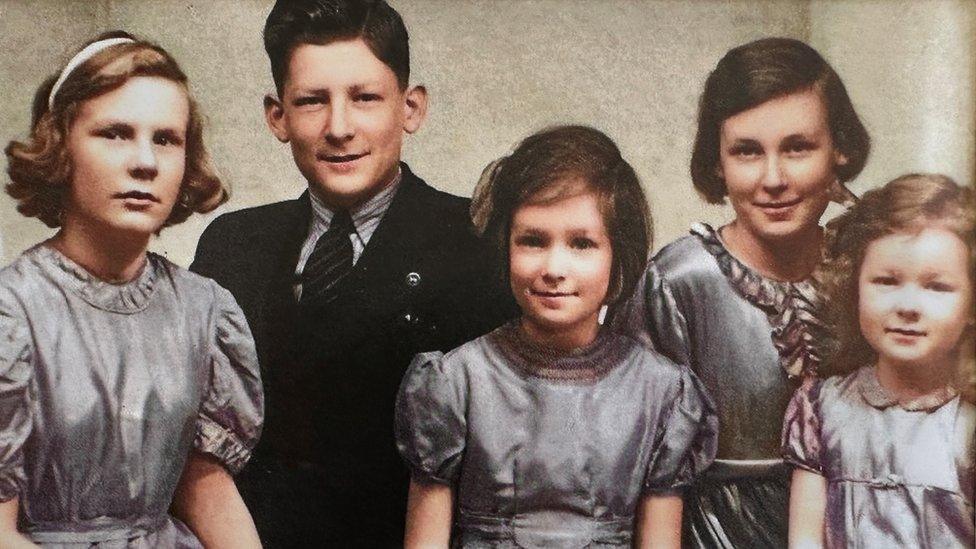 A colour portrait of Alan McQuillin with his sisters