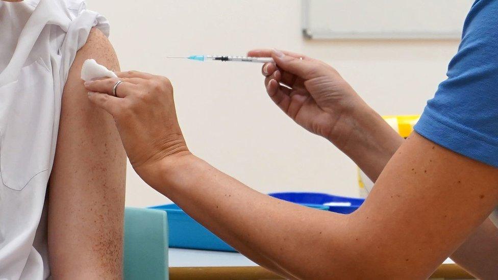 School pupil receiving vaccine