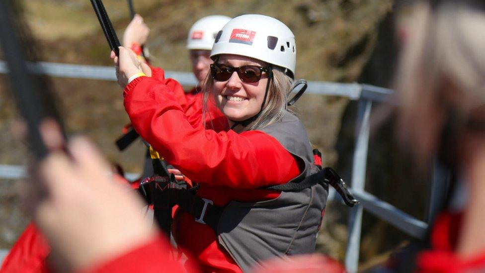 Woman in Zip World harness