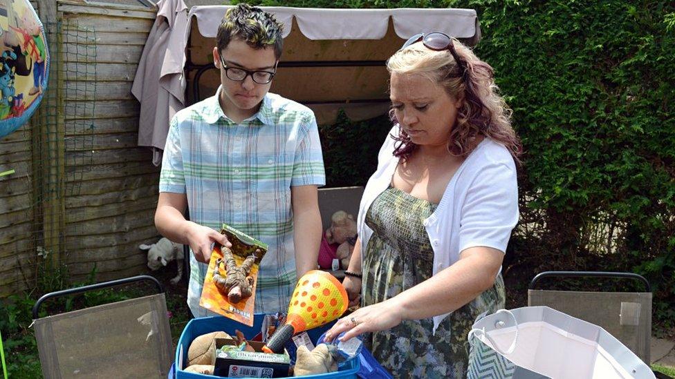 Tyler Murphy and his mum Jan Ellis preparing a gift box