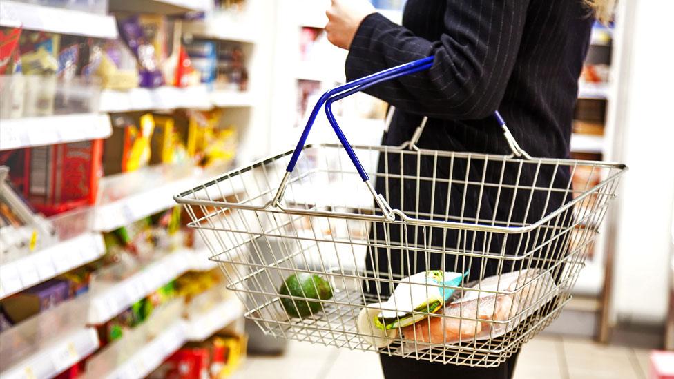 A person shops in a supermarket