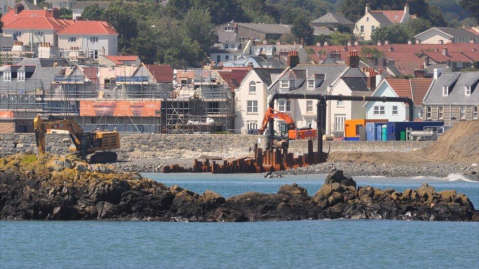 Diggers working on the replacements for the sewage outfall pipes