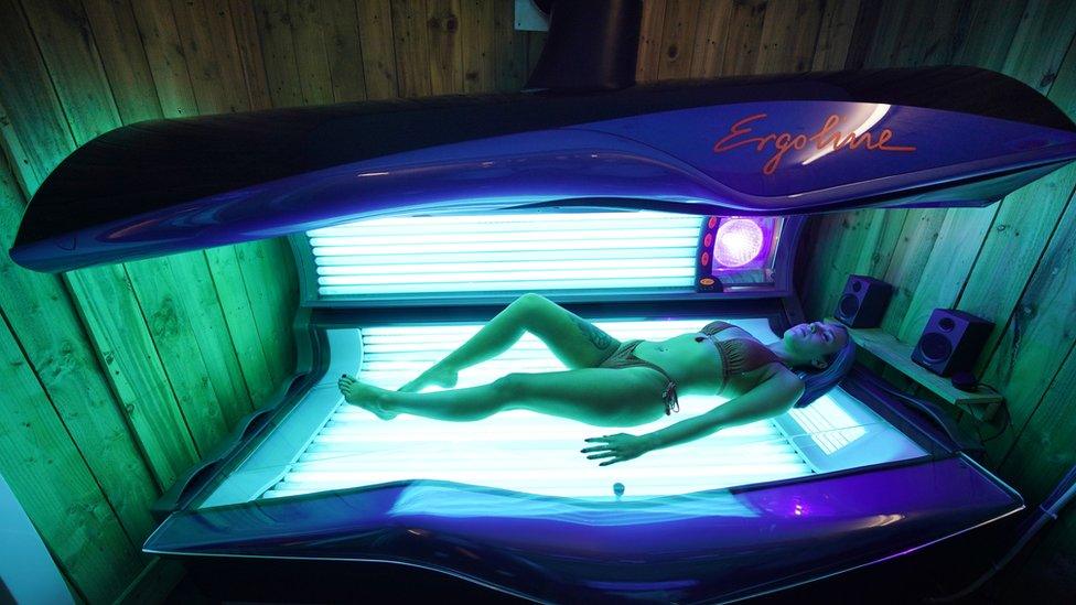 Eleassha Mcqueen, 18, takes to her first sunbed session in three months as Madame Tan opened today in Chirton, North Shields. PA Photo. Picture date: Monday July 13, 2020. Nail bars, beauty salons, tattoo and massage studios, physical therapy businesses, spas and piercing services are able to reopen in the latest lifting of restrictions in England.