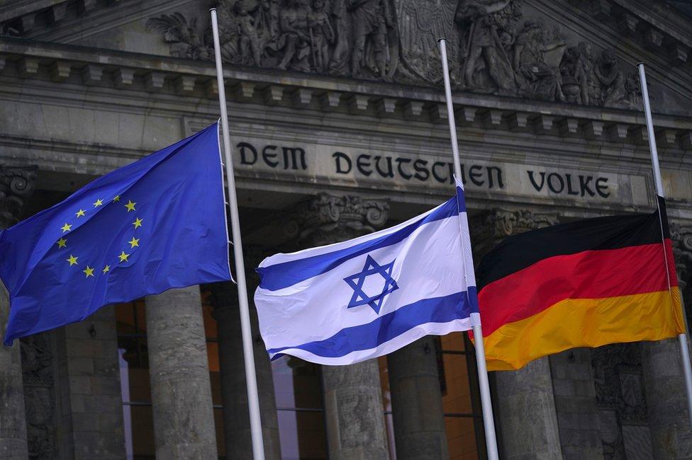 Flags of European Union, Israel and Germany are flown at half mast in Berlin to mark Holocaust Memorial Day