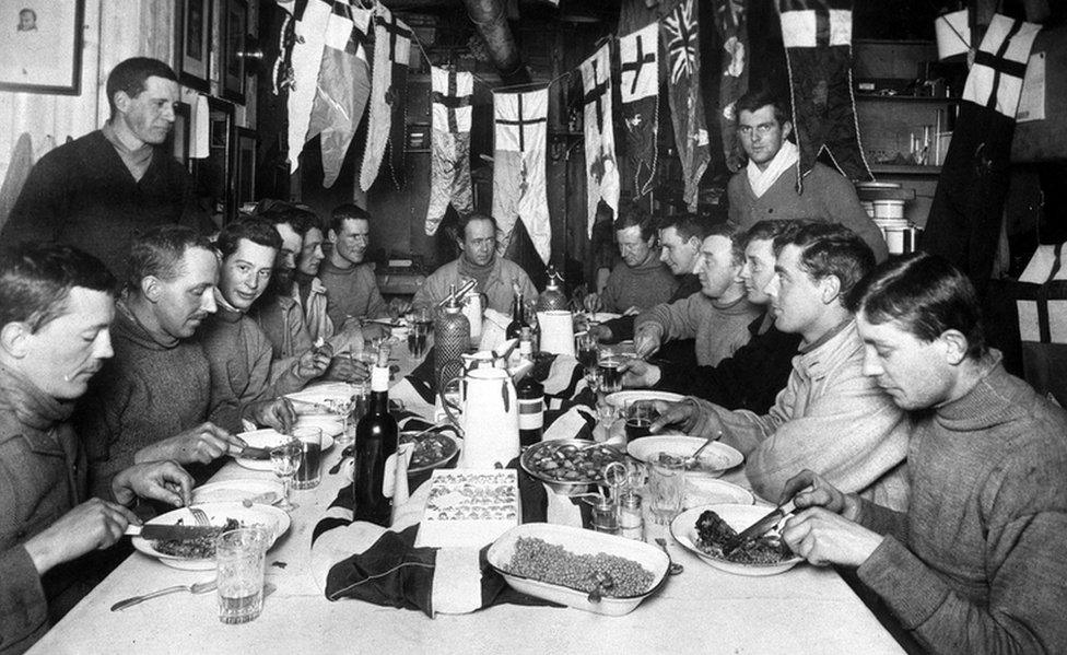 Captain Robert Scott (seated centre, back) and members of his ill-fated expedition to Antarctica enjoying his last birthday party.