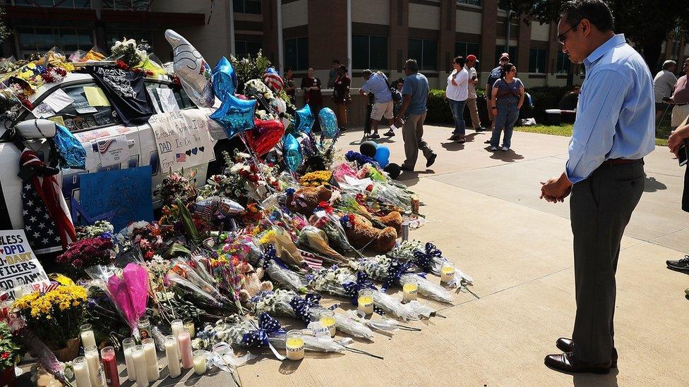 Mourners at a police car in Dallas