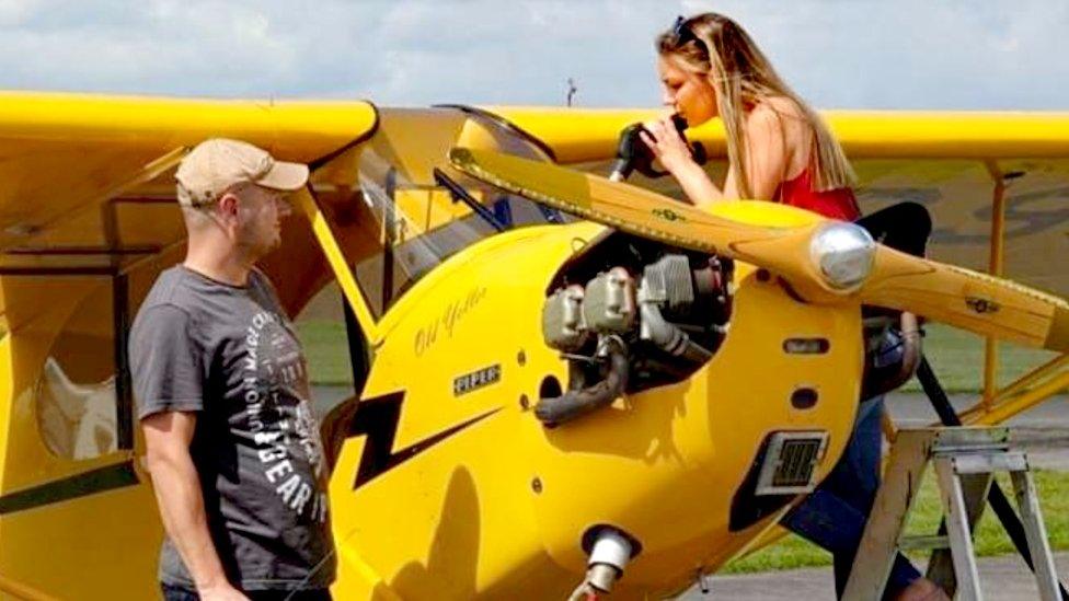 Bethan with one of the vintage aircraft at Breighton Airfield