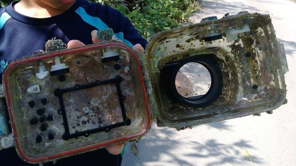 Camera case overgrown with barnacles