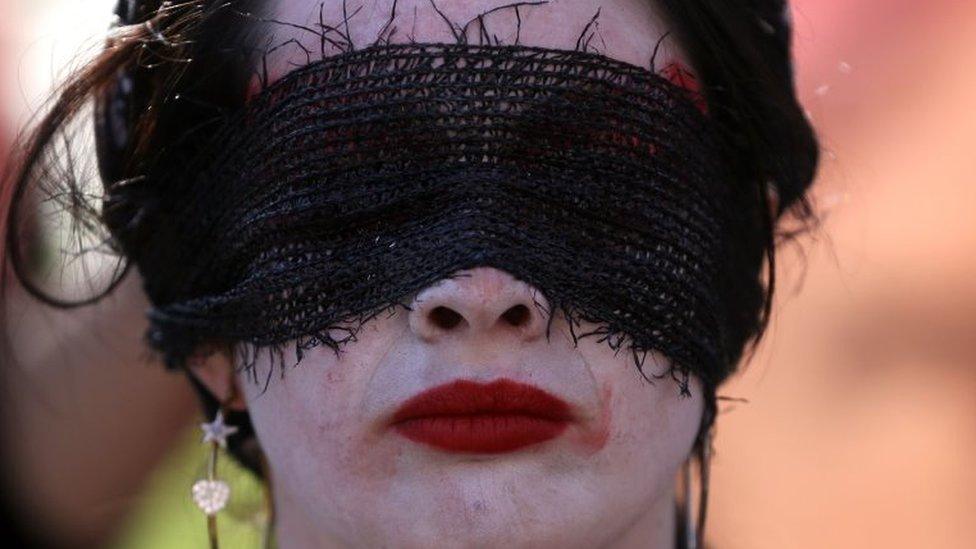 A woman takes part in a march to demand "non-sexist" education and to protest against the slow pace of educational reform in Santiago, on June 6, 2018.