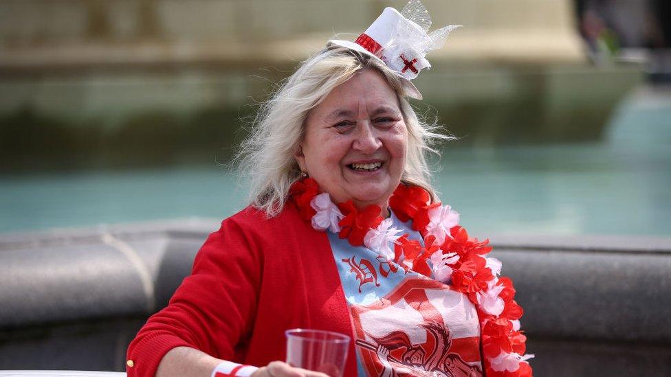 A member of the public attends the Feast of St George celebrations in Trafalgar Square