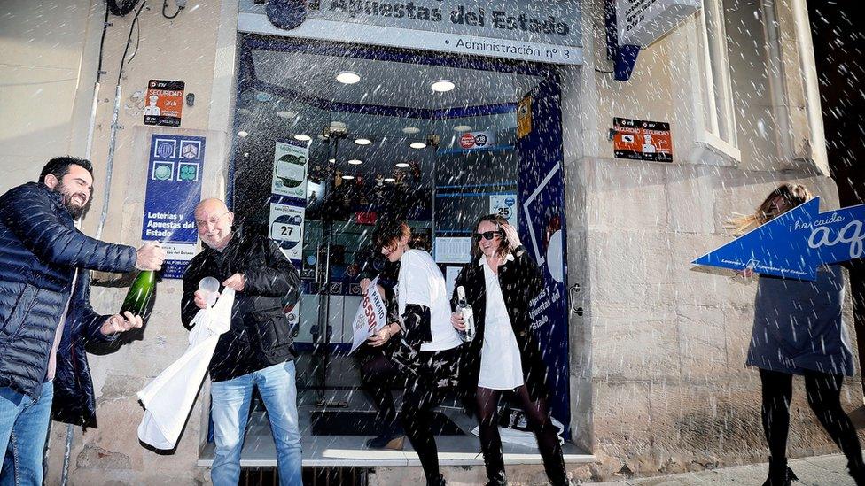 People celebrate at the lottery administration number 3 in Alcoy, Alicante.