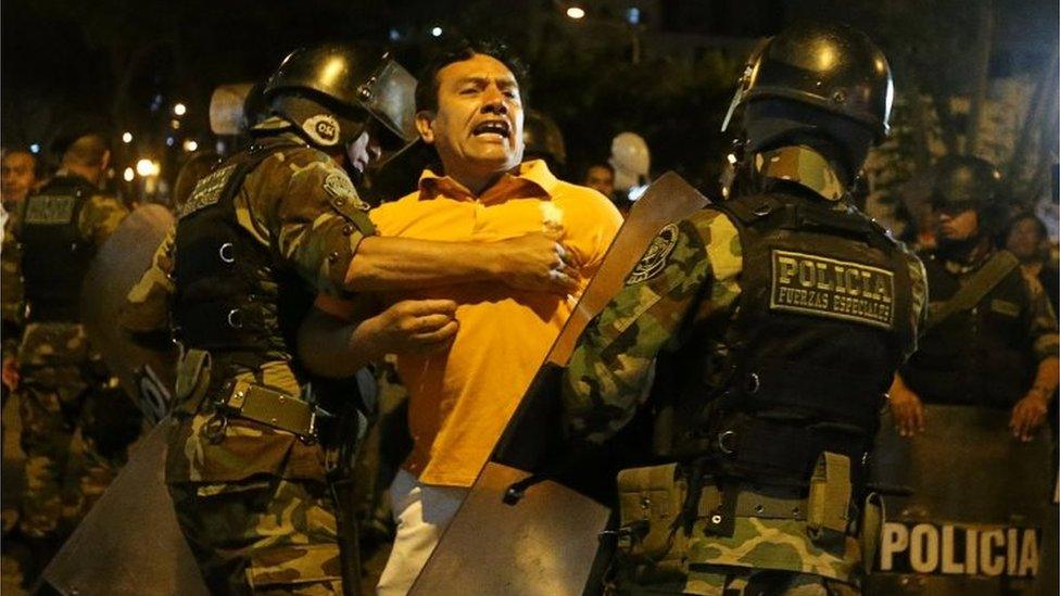 Protesters clash with police near Centerio hospital after Peruvian President Pedro Pablo Kuczynski pardoned former President Alberto Fujimori in Lima, Peru, December 25, 2017.