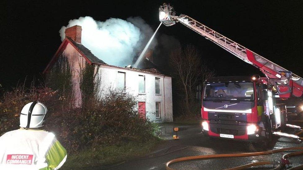 Firefighters tackling blaze with an aerial appliance