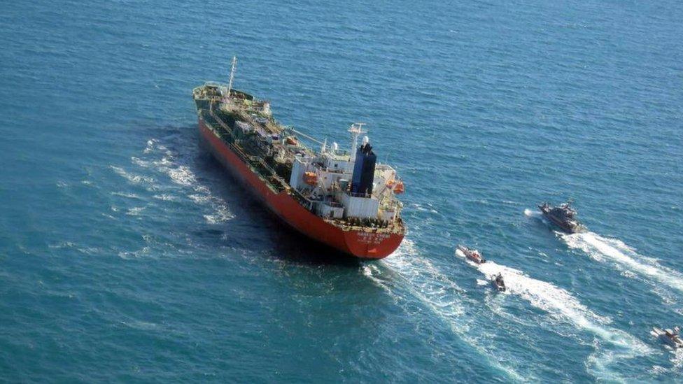 A handout photo made available by the Tasnim News agency shows Iranian Revolutionary Guard Corps (IRGC) jet boats seizing a South-Korean flagged tanker named Hankuk Chemi in Persian Gulf, 04 January 2021.