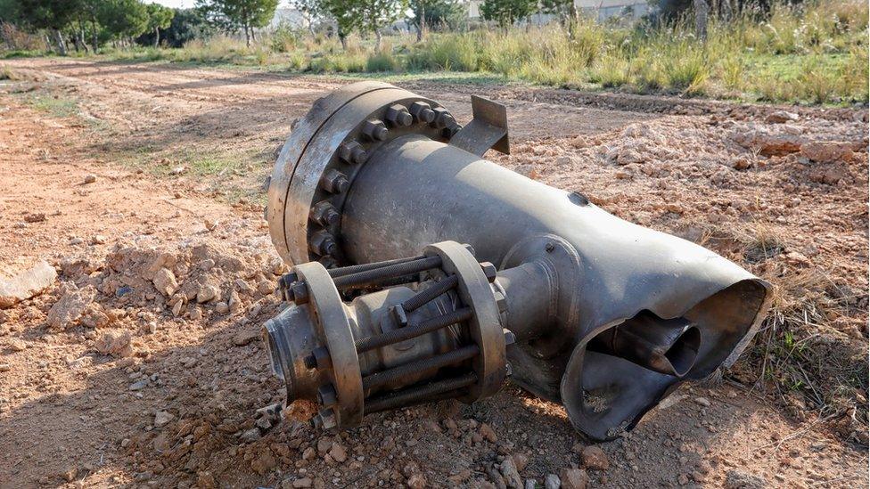 A piece of machinery projected by an explosion at a petrochemical factory lies in a field surrounding the area of the blast in Tarragona, Spain, 15 January 2020