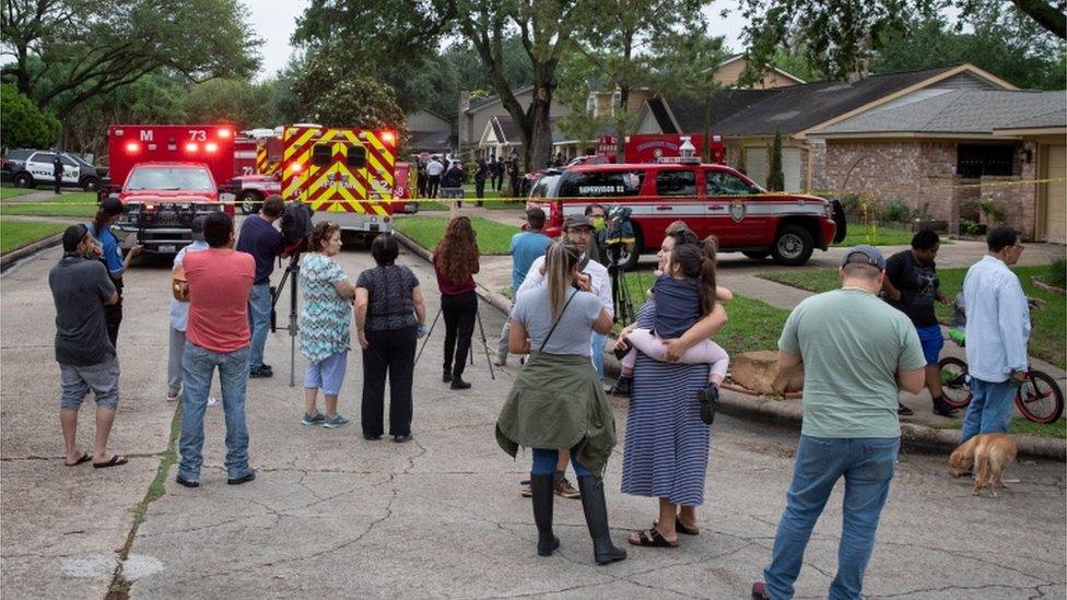 Neighbours watch the investigation