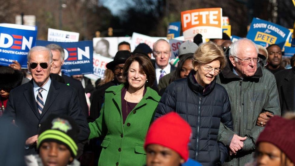 Democratic presidential candidates, former Vice President Joe Biden, left, Amy Klobuchar , Elizabeth Warren , Bernie Sanders