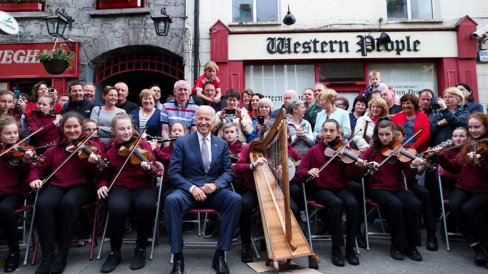 US Vice President Joe Biden sitting with members of local band Rolling Wave in Castlebar, County Mayo