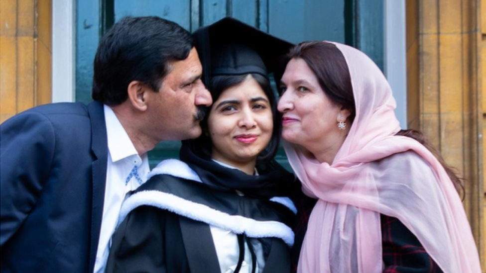 Malala celebrating with her parents