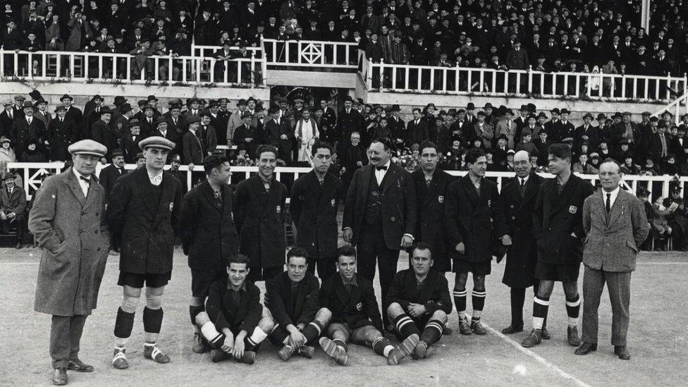 Jack Greenwell (left) with players and staff at FC Barcelona