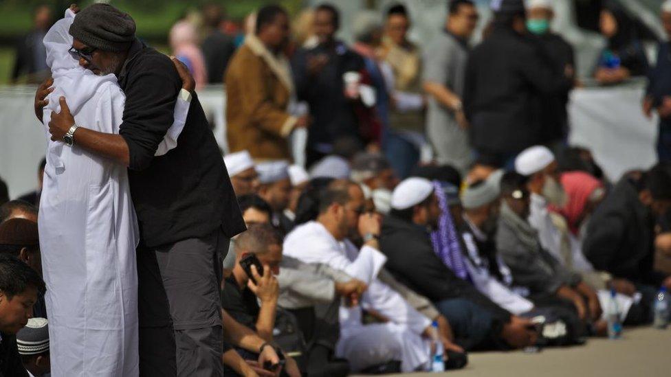 A man consoles a relative of the victims during the first Friday Prayer after twin terror attacks targeting mosques in Christchurch, New Zealand