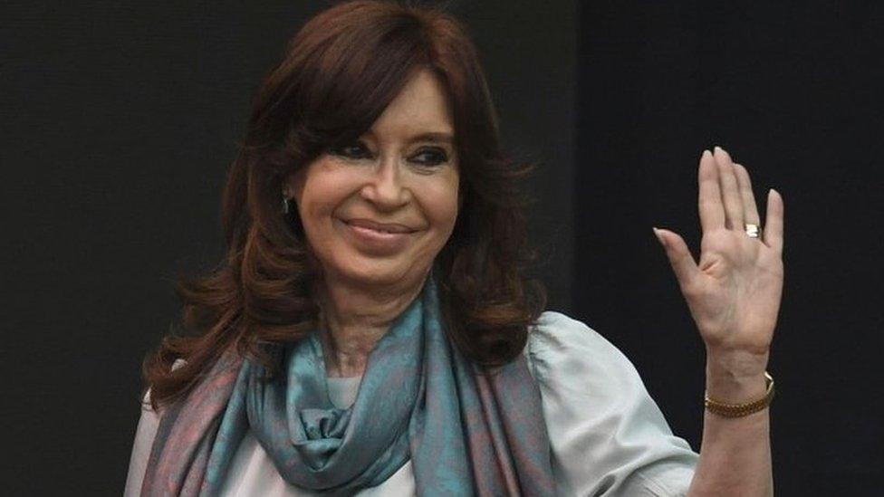 Cristina Fernandez de Kirchner waves to supporters