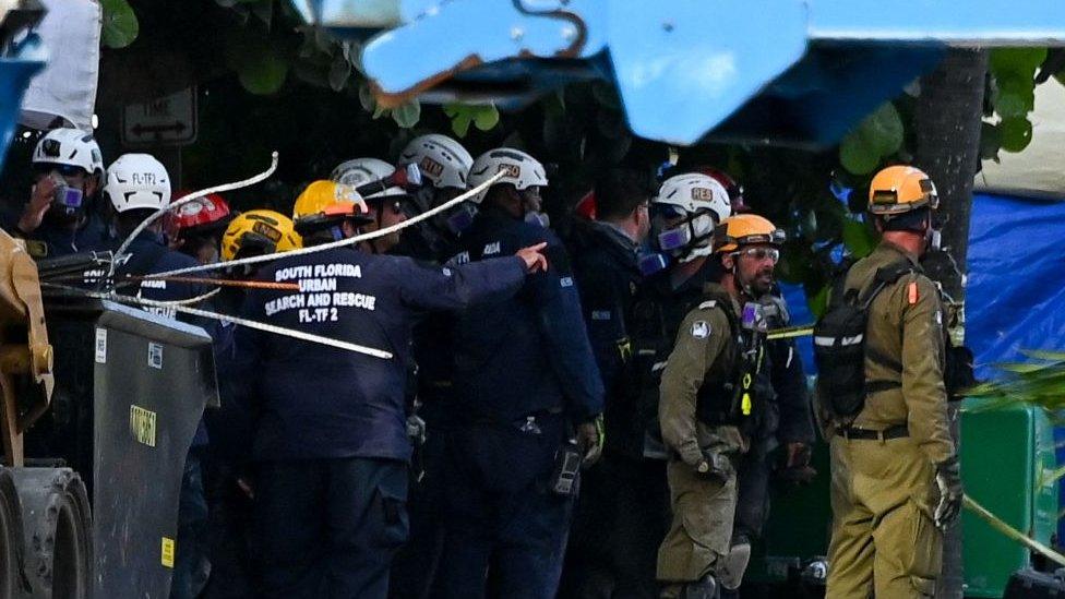 Rescue workers at the scene of the collapsed Miami apartment block, June 2021