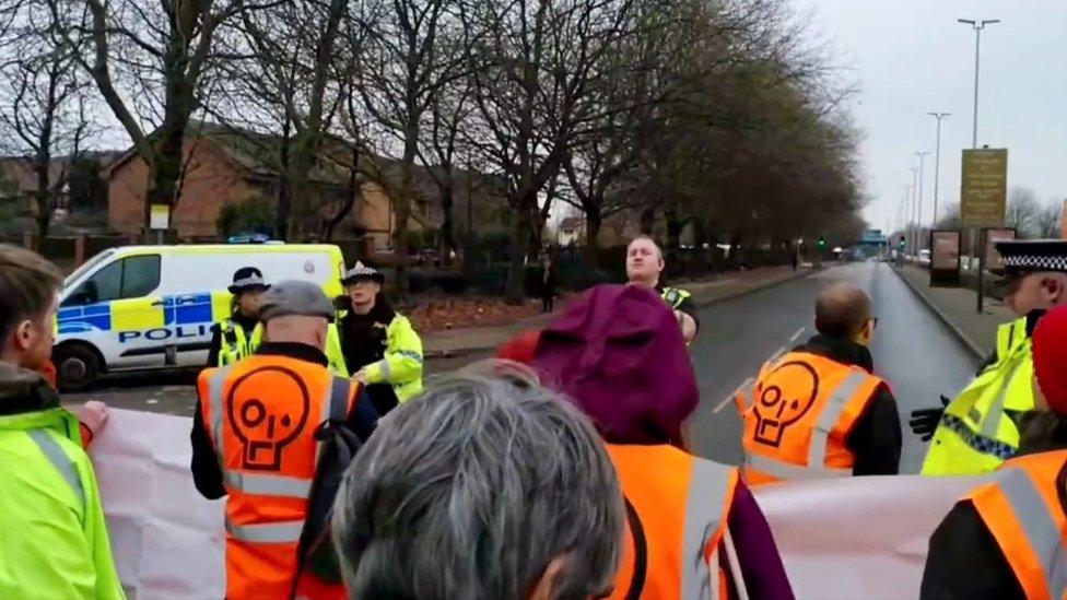 police interact with protesters