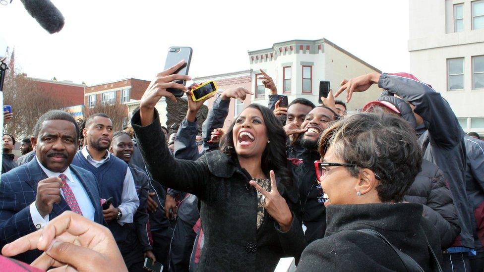 Omarosa Manigault, Donald Trump's director of communications, take selfies with the Talladega Tornadoes