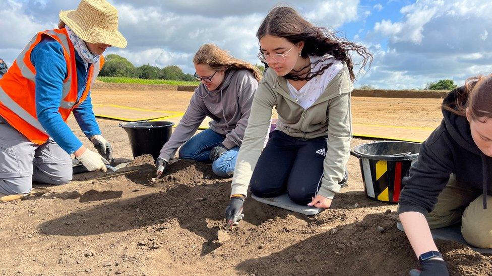 Volunteers work on the site over the summer