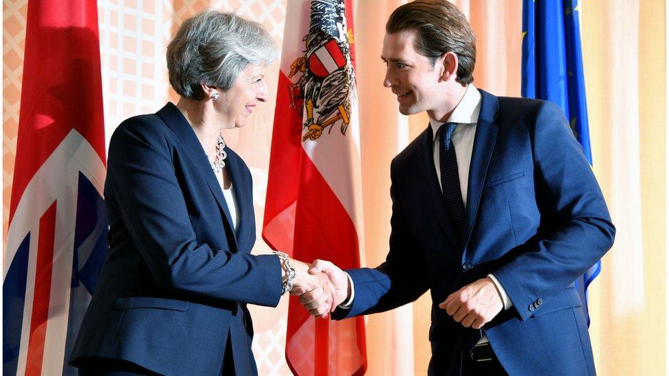 Austrian Chancellor Sebastian Kurz welcomes Theresa May for the opening of Salzburg's festival for opera, drama and concerts on July 27, 2018