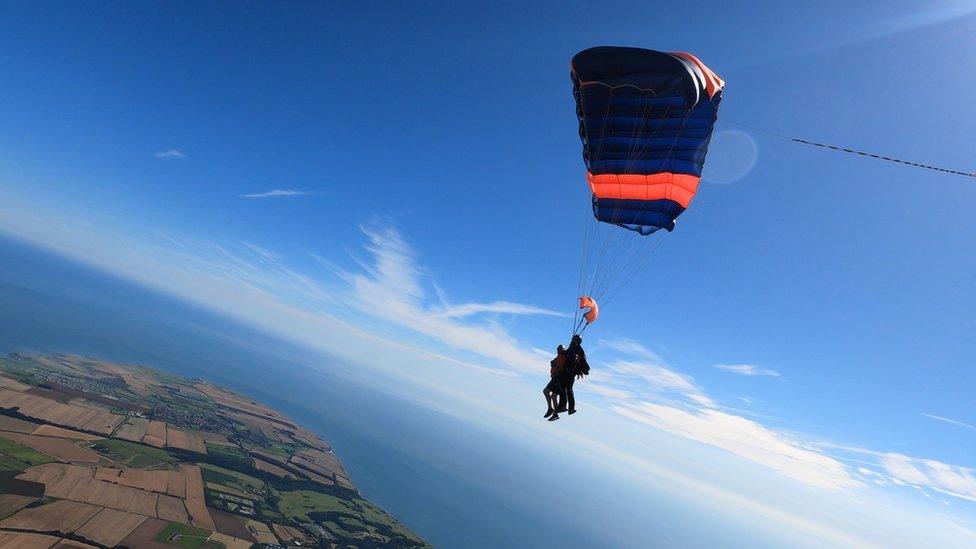 George Mattinson in the sky mid skydive