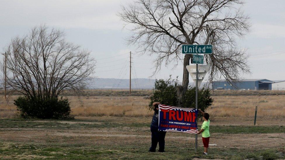 Trump fans line the road in Colorado to catch a glimpse of their man in his motorcade