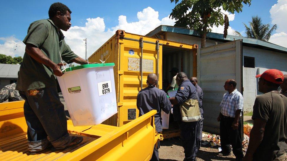 Election officials and ballot boxes from the 2012 PNG General election